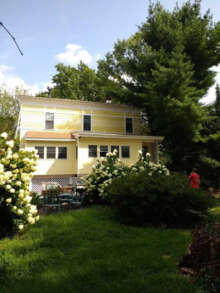 Exterior Victorian remodel. Painted yellow and white